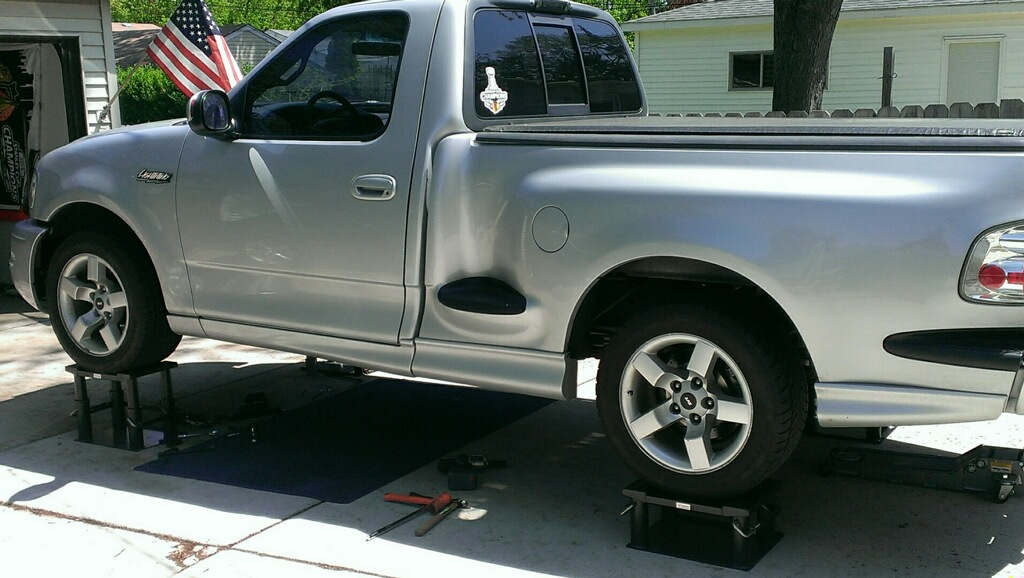 pickup truck on lift stands - great for at-home auto repair